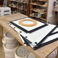 1. Lay flat on a table