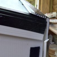 6. Then bring up the back and attach via velcro tab