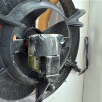Waterproofing of motor with plastic shield and latex